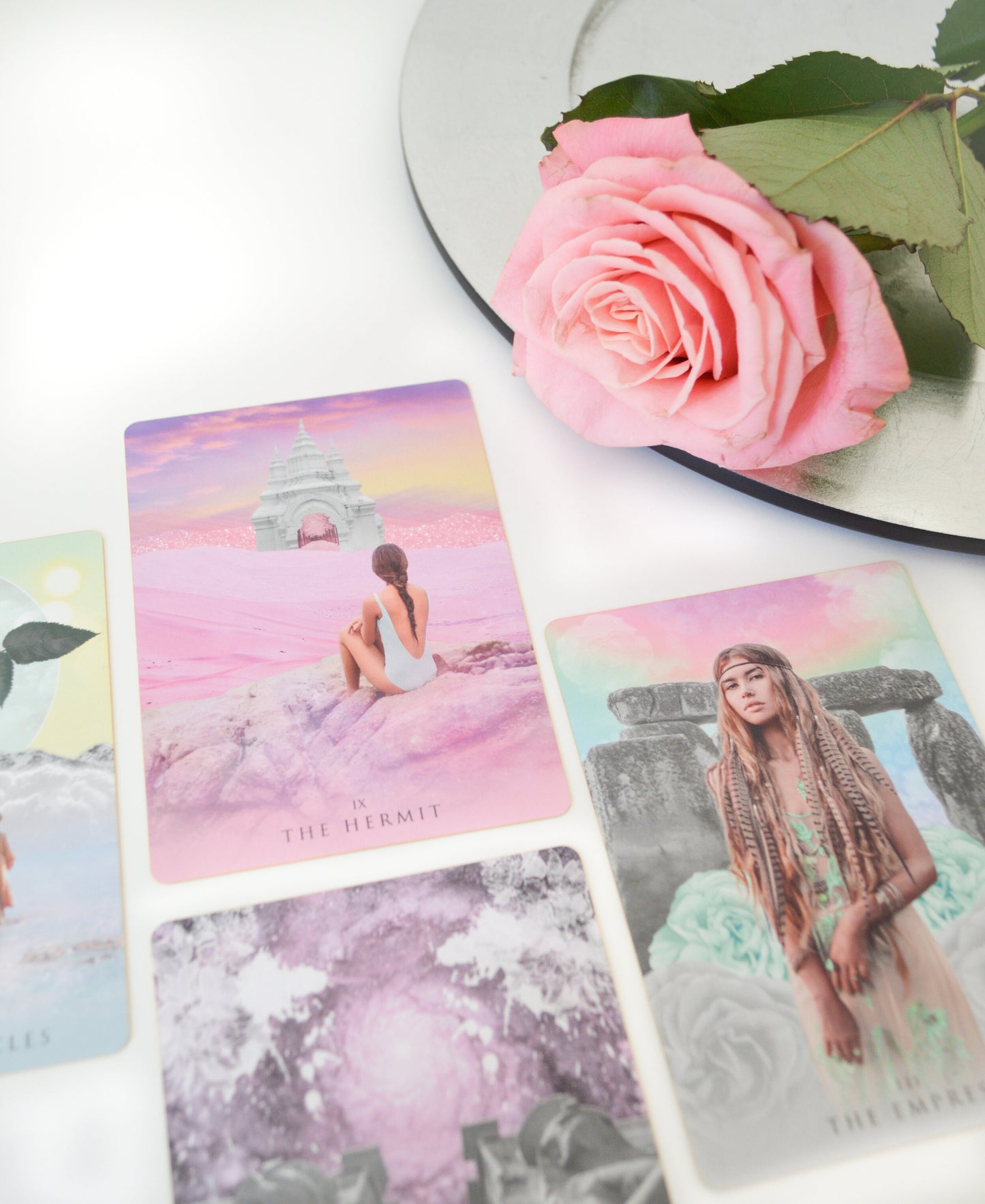 Tarot deck with cards in a spread with sacred rose