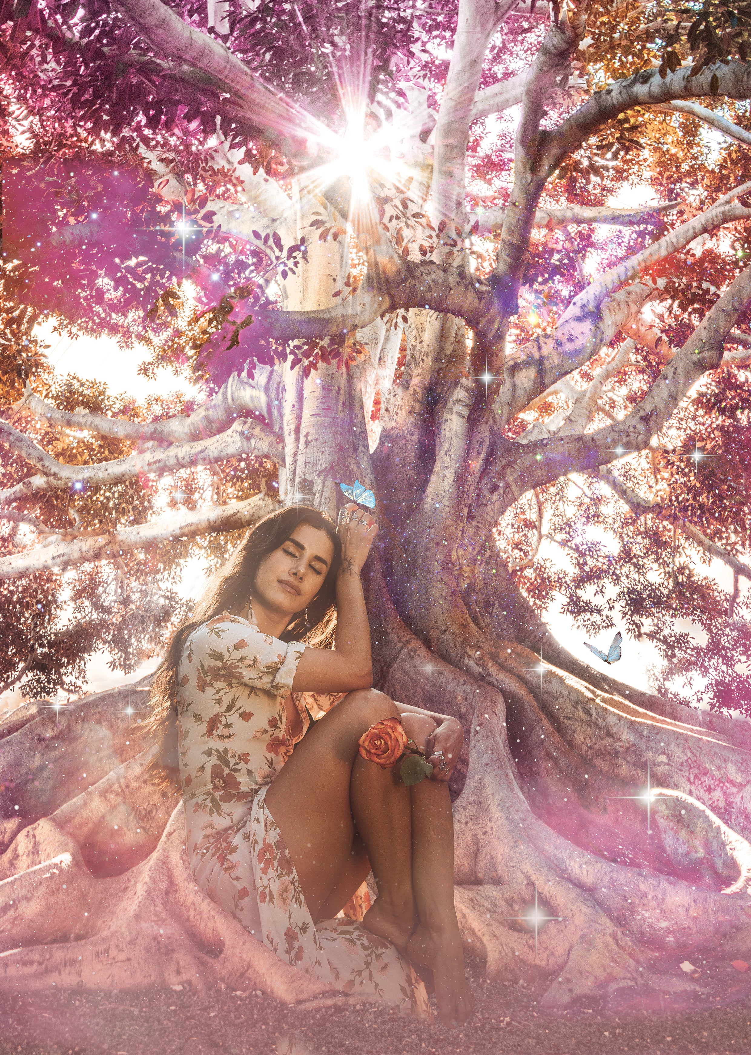 Woman sitting under a large tree with a magical, fairy-tale-like atmosphere. Bella Divine